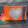 hammill and co canvas clutch in bright orange with bright white star on front online at mary and me