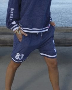 navy sweat shorts with white stars and number 83