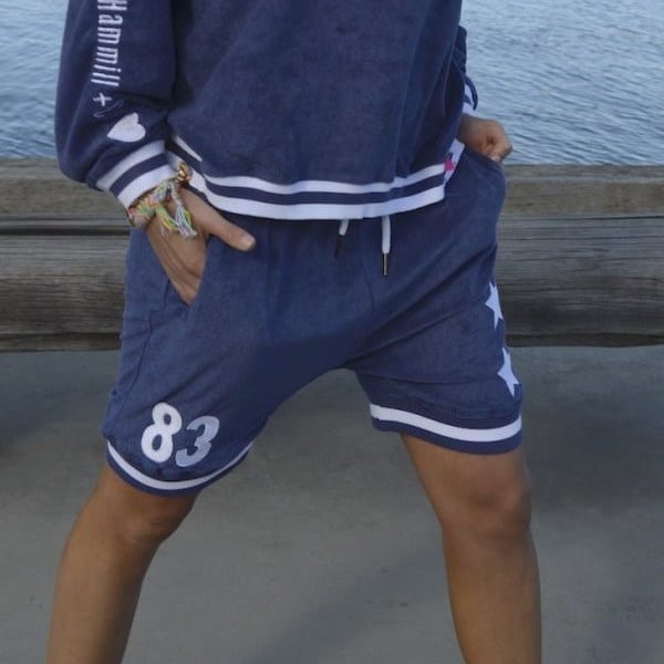navy sweat shorts with white stars and number 83