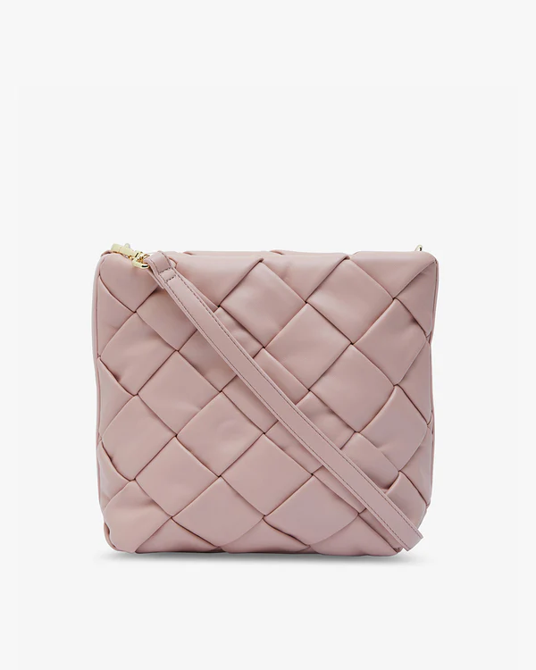 blush crossbody bag with think strap criss cross pattern on front and back